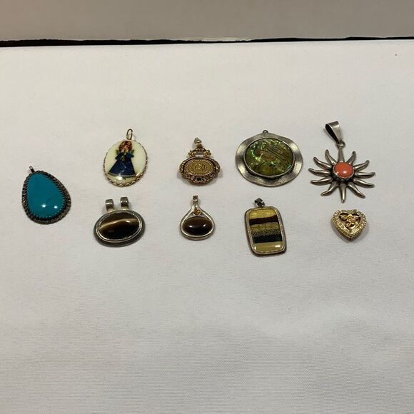 Vintage bundle of NINE pendants. Only one piece says sterling on the back. - Picture 1 of 11